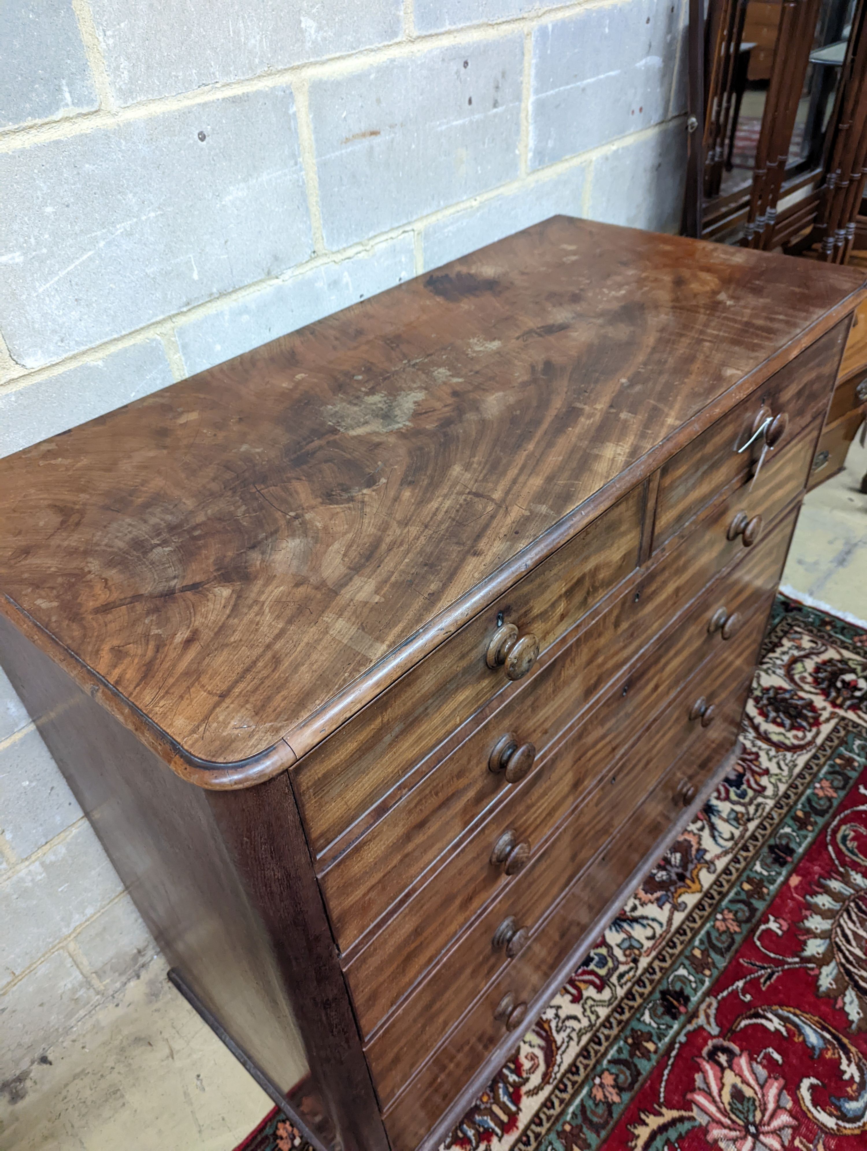 A Victorian mahogany chest of two short and four long drawers. (No feet) W-120cm, D-58cm, H-107cm.
